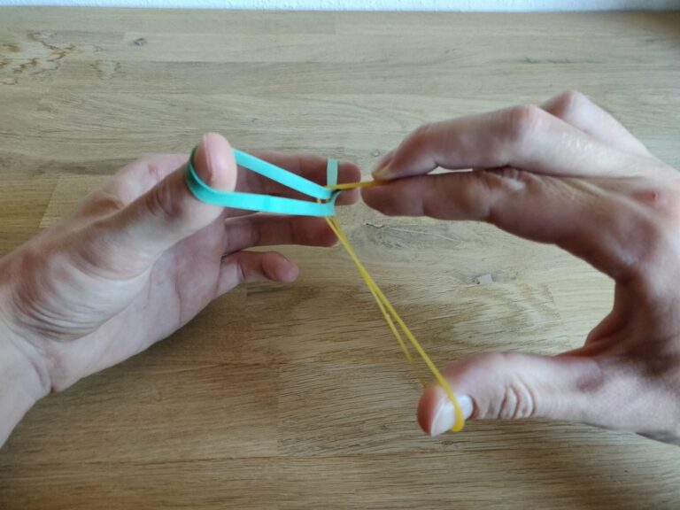 “Crazy Man’s Handcuffs” Rubberband through rubberband trick