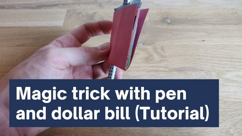 Magic trick with pen and dollar bill