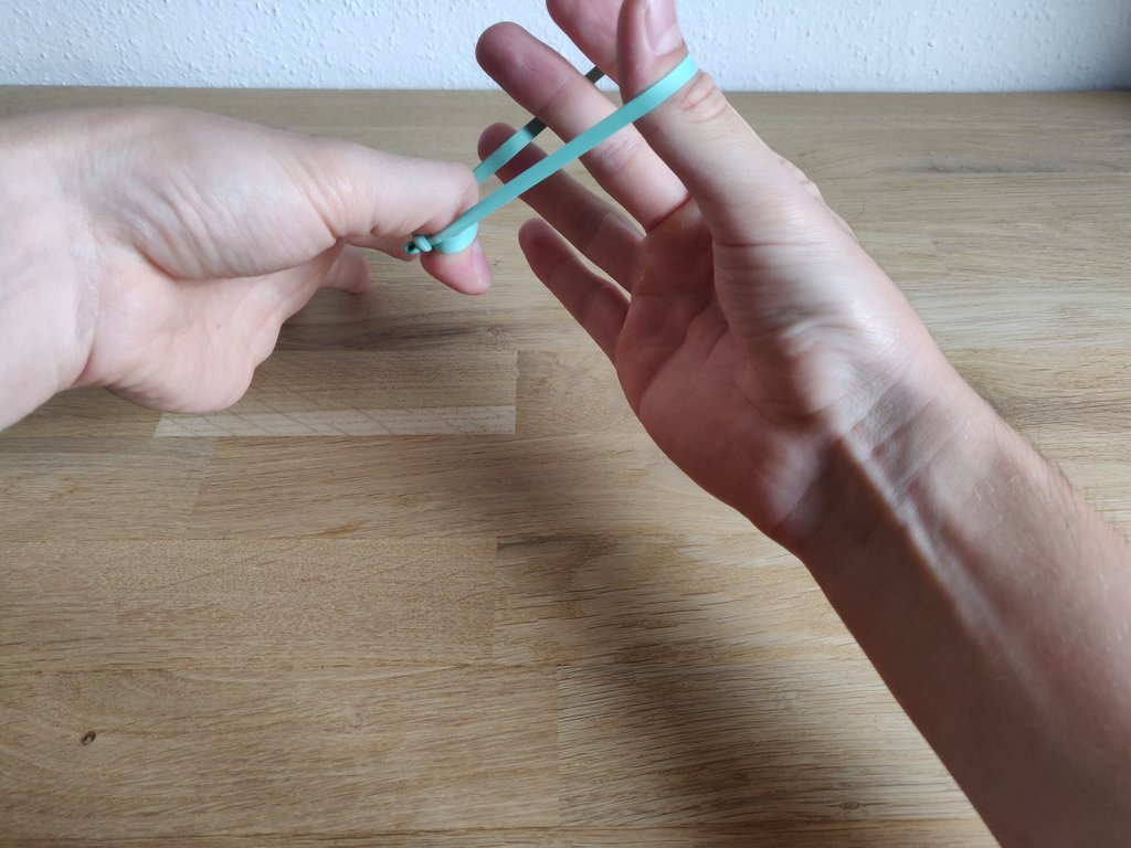 Rubber band through finger explained 7