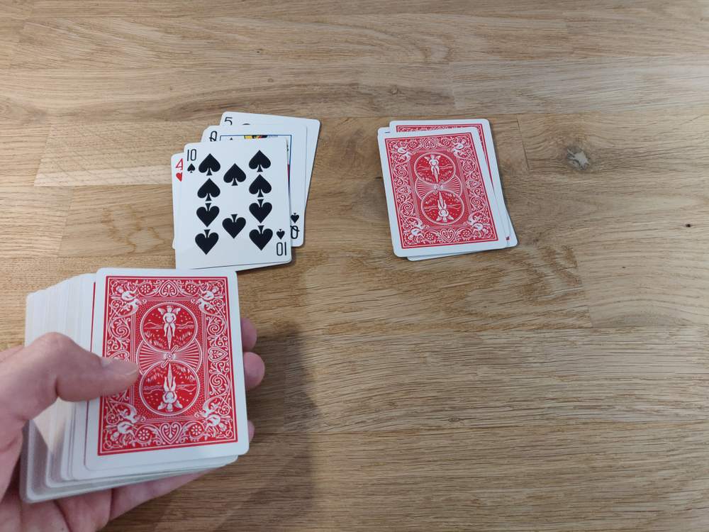 Dealing the cards onto the table 3